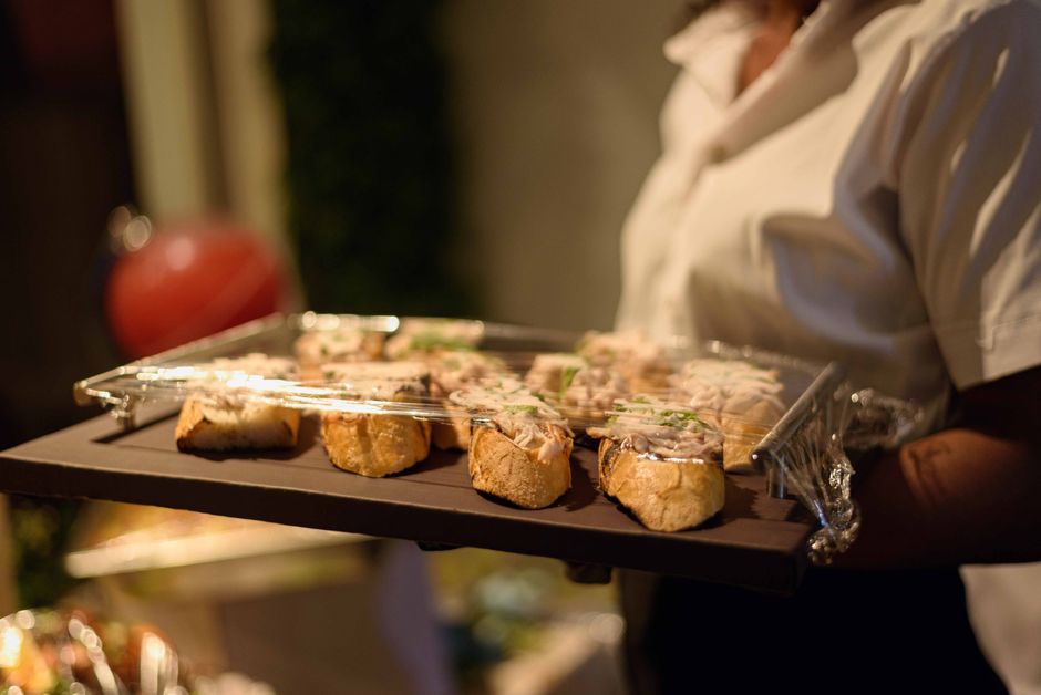 Waiter serving gourmet canapes at a wedding reception