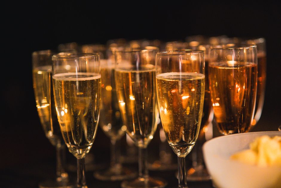 Champagne glasses toast at a catered private party